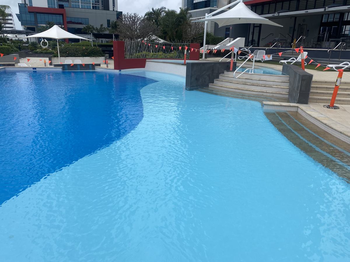 Freeform pool at Southport Central with a two-tone membrane